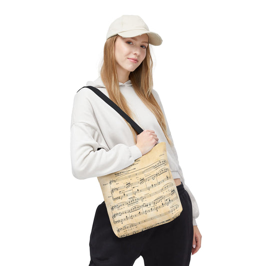 Model holds tote bag with La Boheme sheet music design - Size small